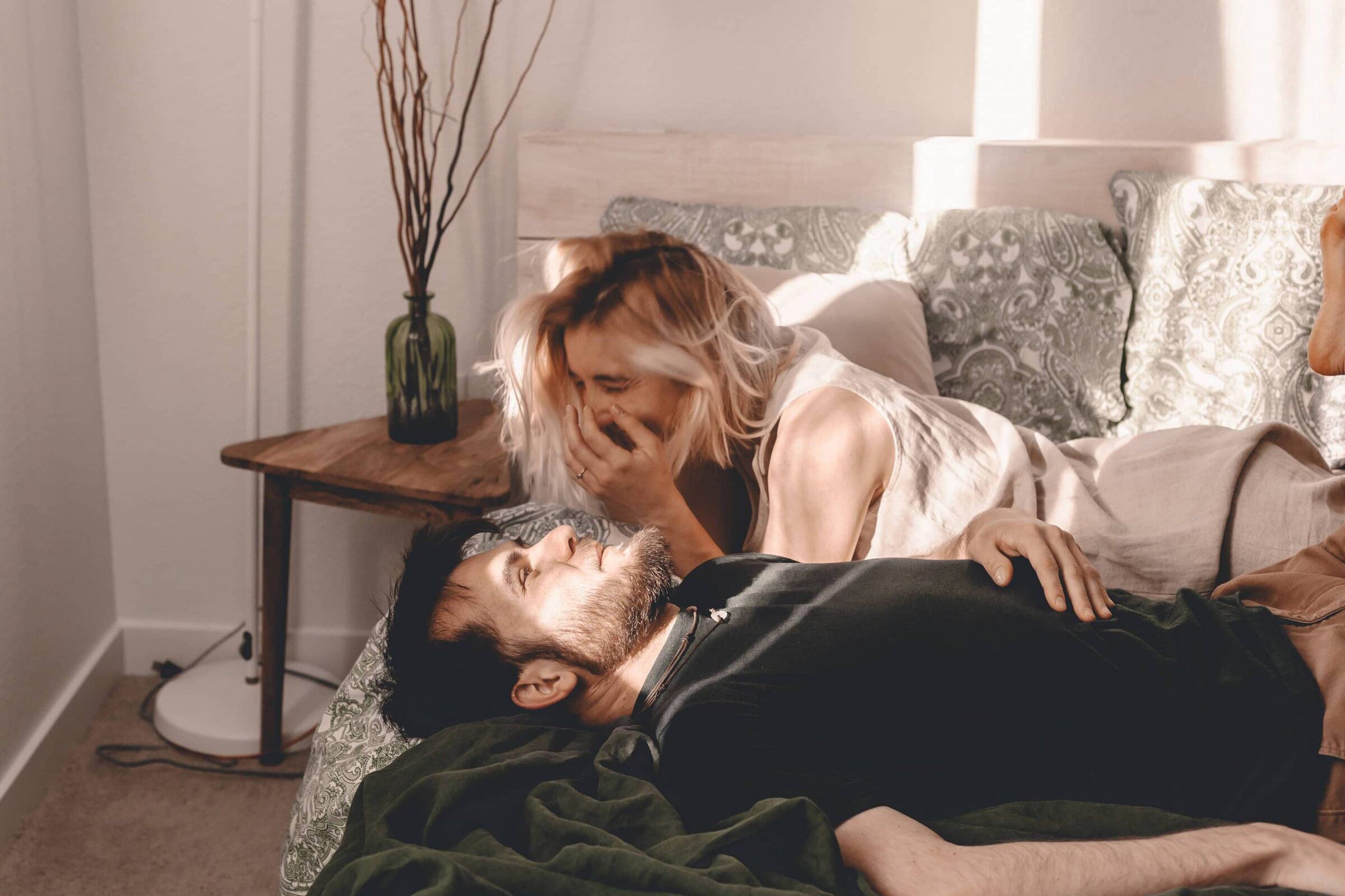 A couple relaxing together on the floor of their living room